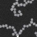 Self-assembling Nanocubes for Next Generation Antennas and Lenses